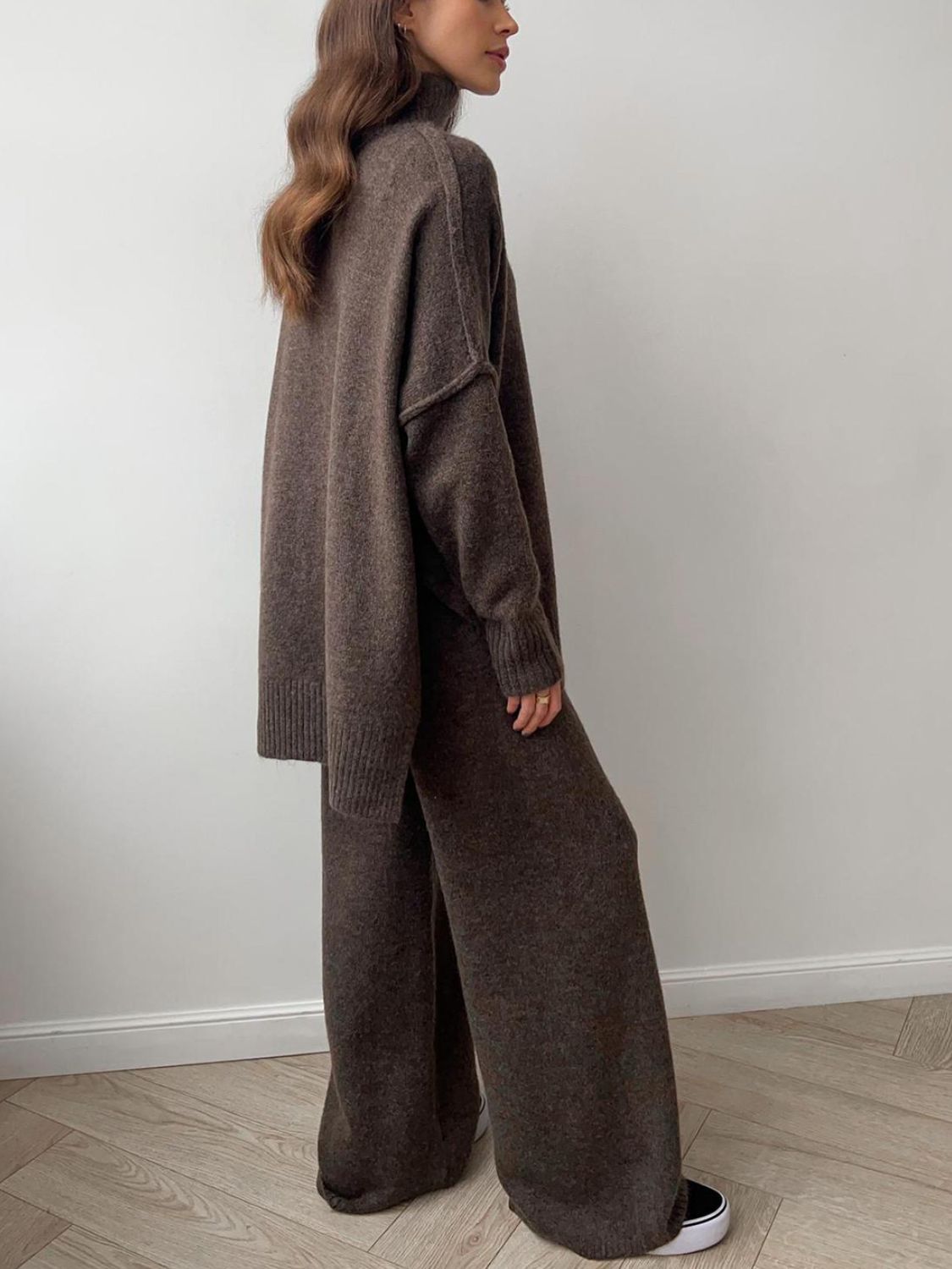 Model wearing cozy brown knit turtleneck and pants sweater set