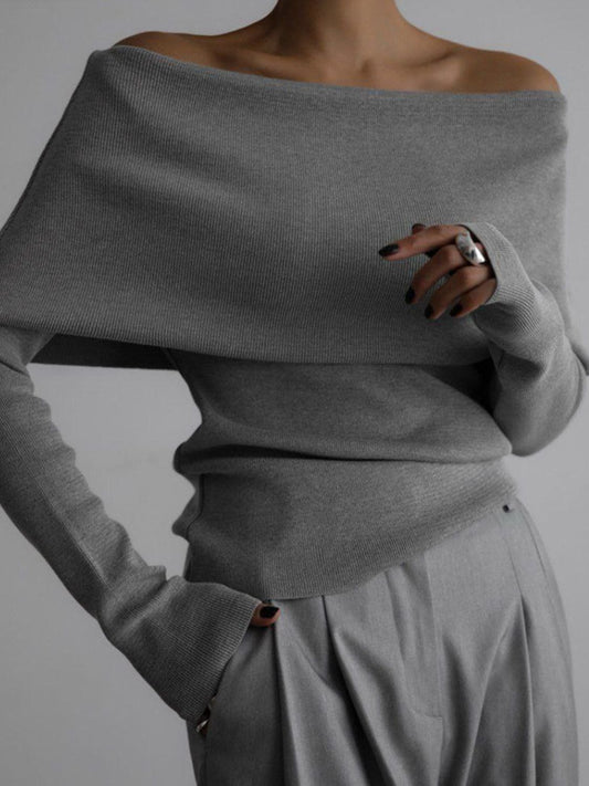 Woman wearing stylish gray off-shoulder long sleeve knit top