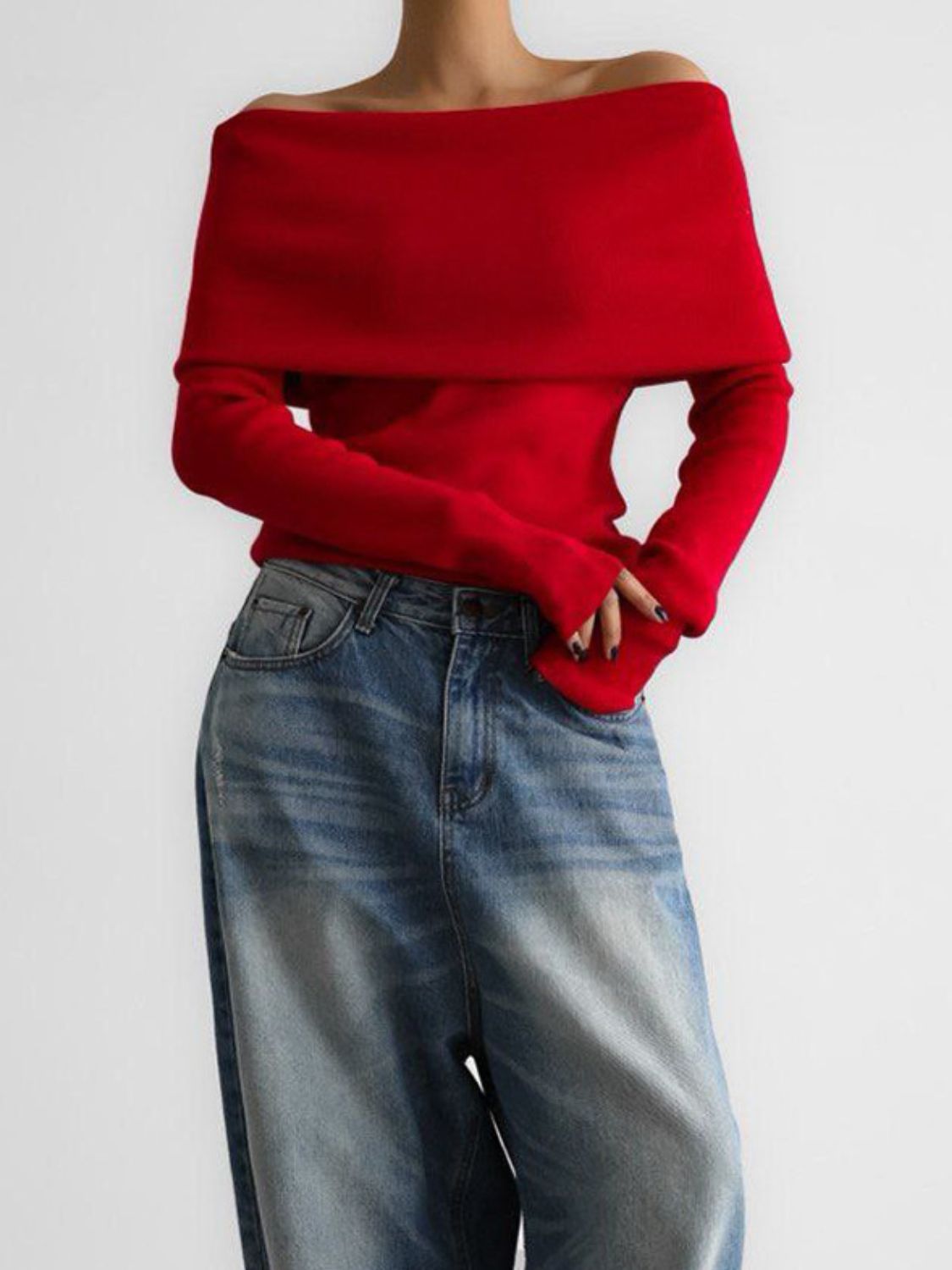 Woman wearing stylish red off-shoulder long sleeve knit top