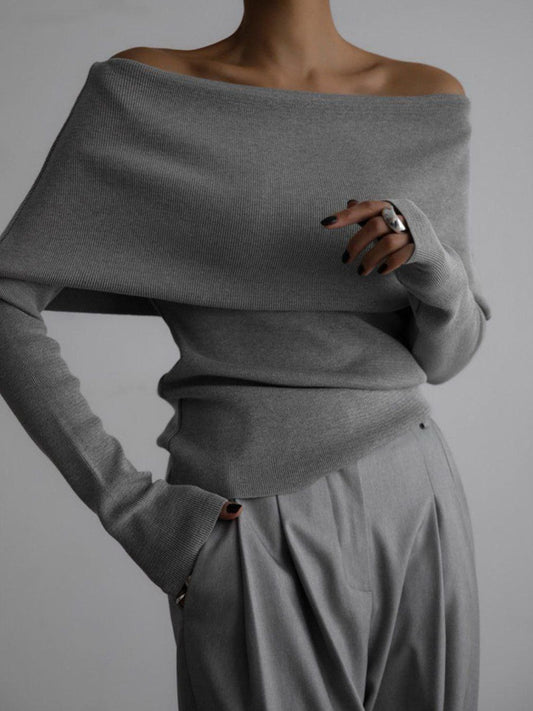 Woman wearing stylish gray off-shoulder long sleeve knit top