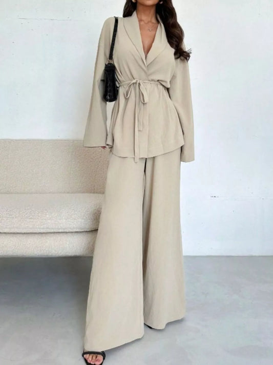 Woman wearing a front-tied shirt and wide-leg pants co-ord set, a spring 2026 trouser trend