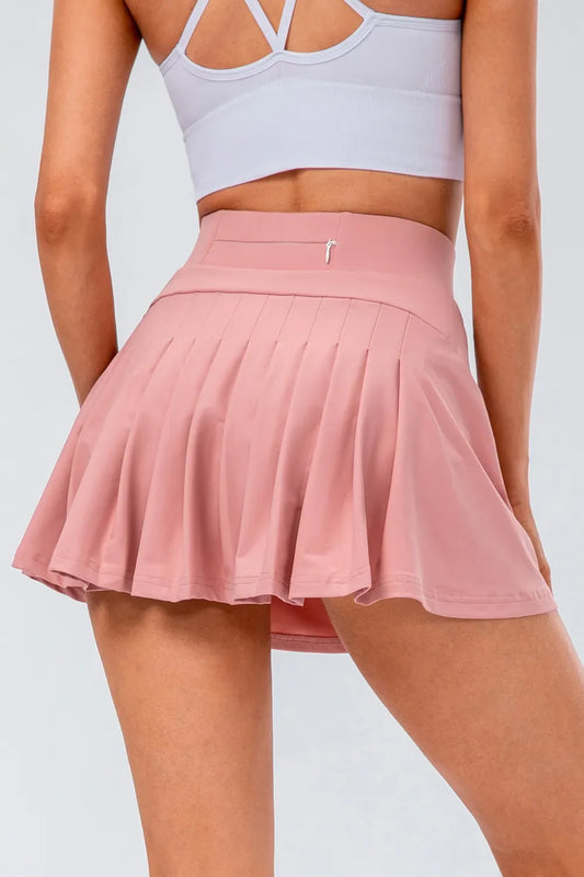 Blush pink high waist pleated active tennis skirt styled for court-to-street wear