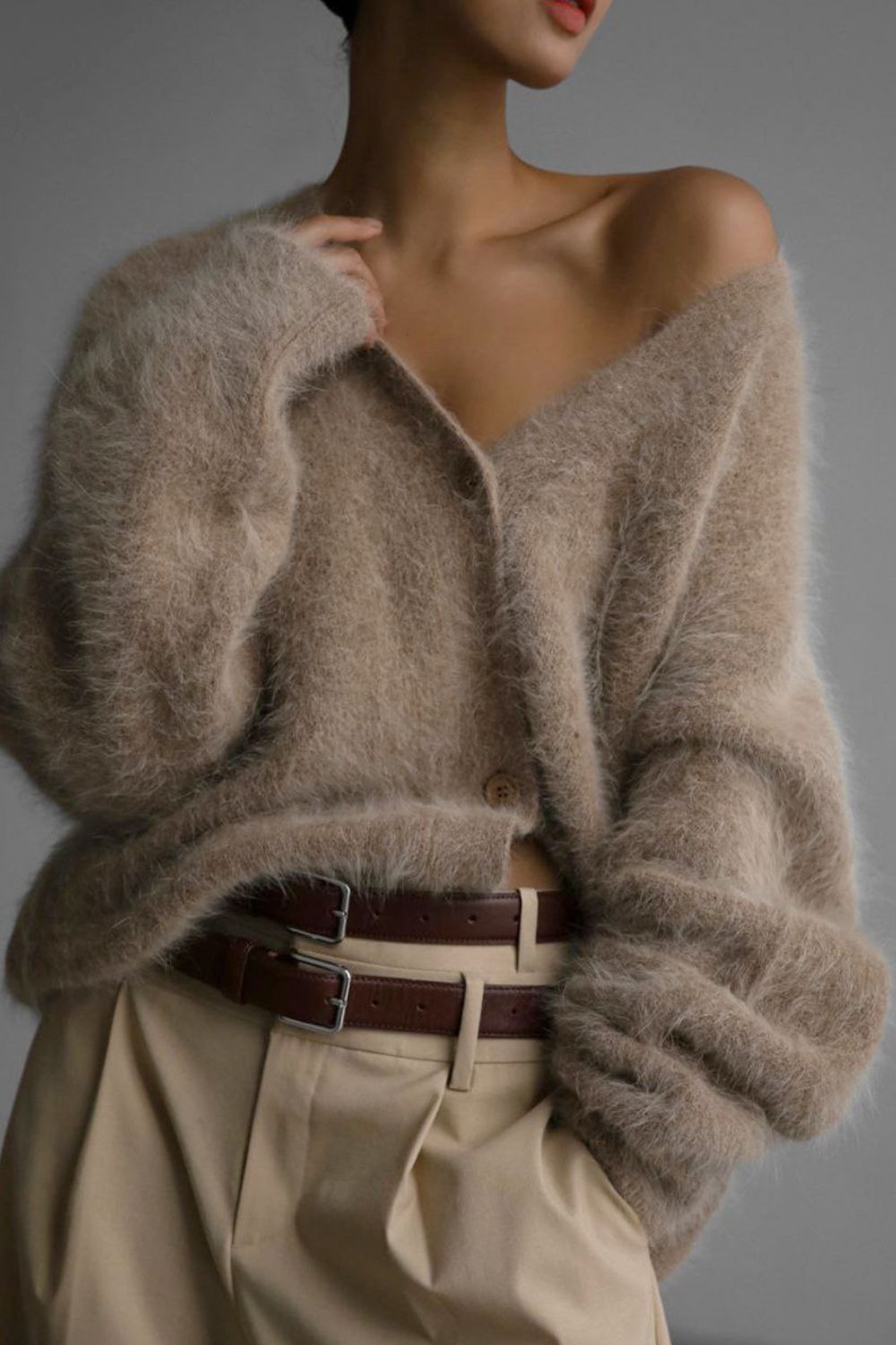 Woman wearing cozy khaki fuzzy button down cardigan