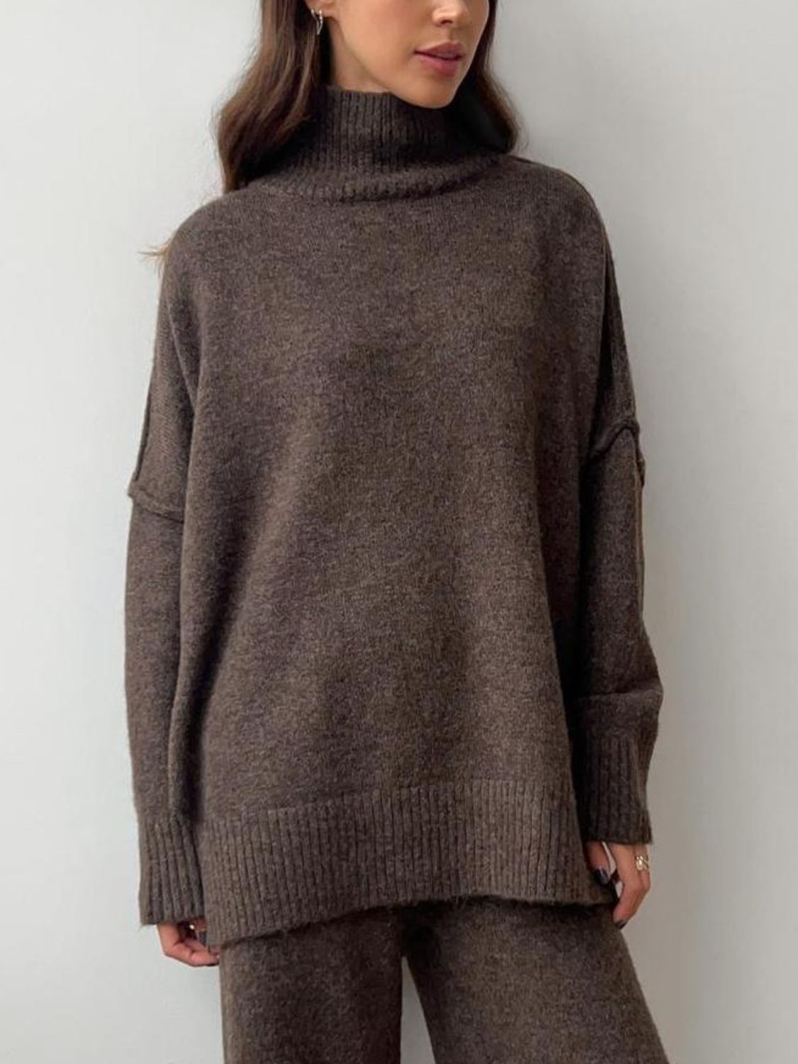 Model wearing cozy brown knit turtleneck and pants sweater set