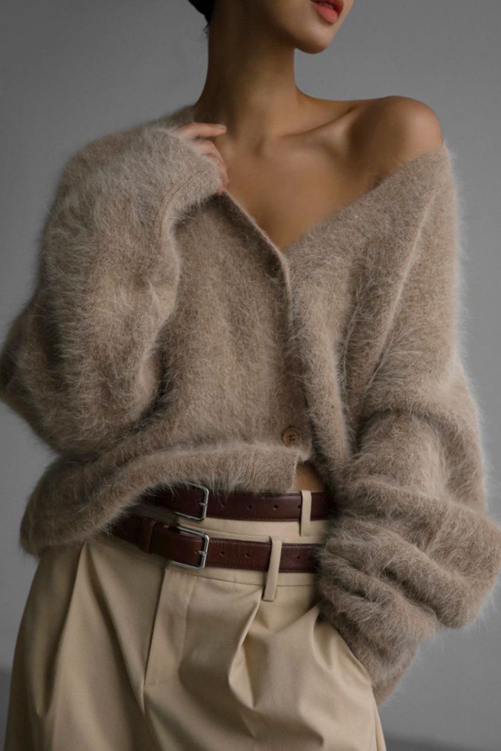 Woman wearing cozy khaki fuzzy button down cardigan