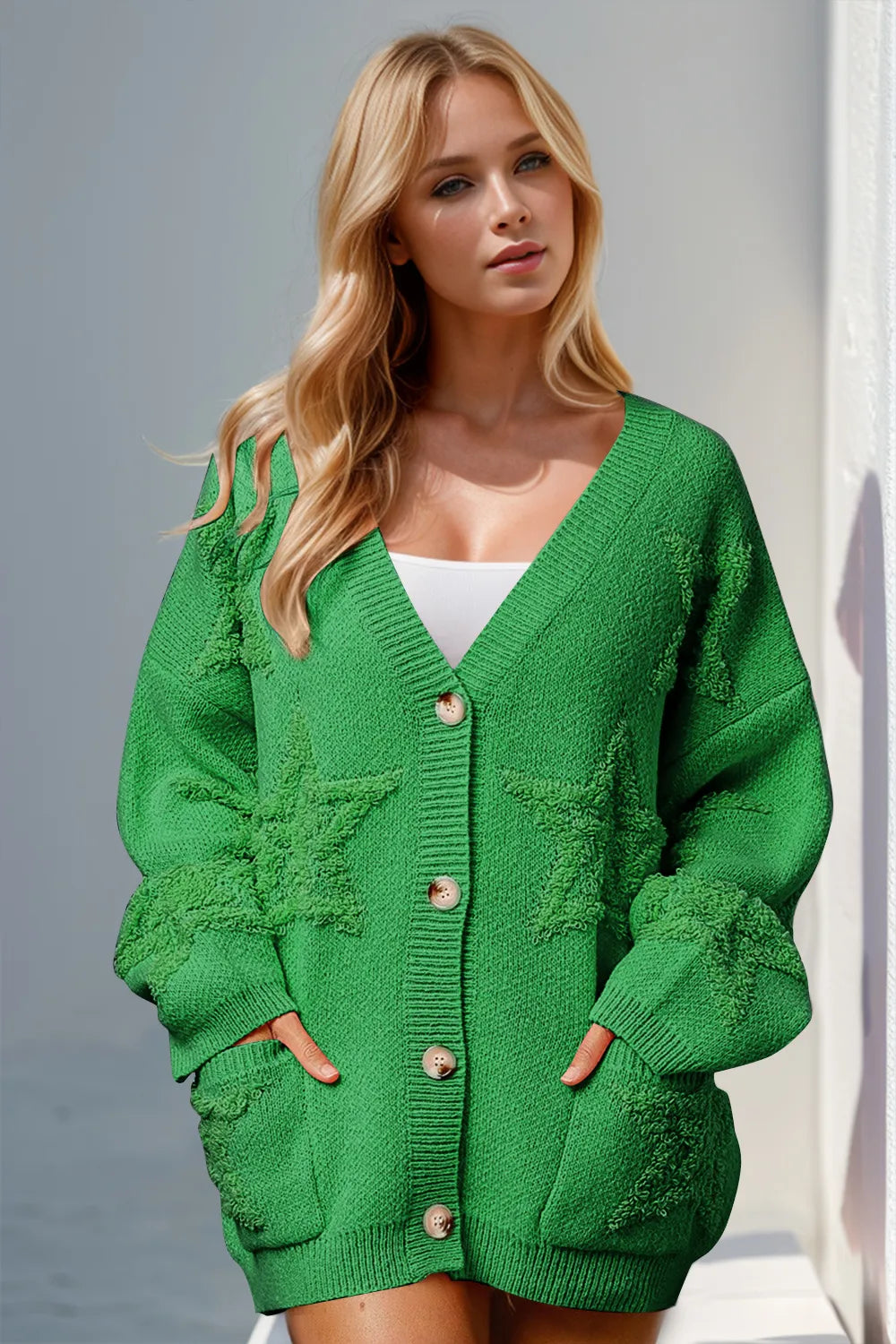 Woman wearing stylish green button up star pattern cardigan