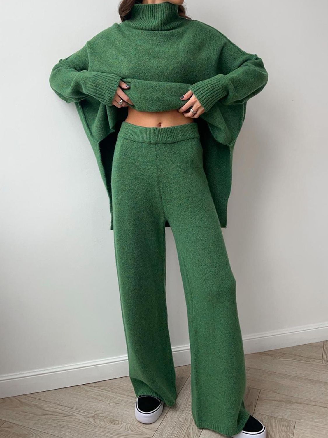 Model wearing cozy green knit turtleneck and pants sweater set