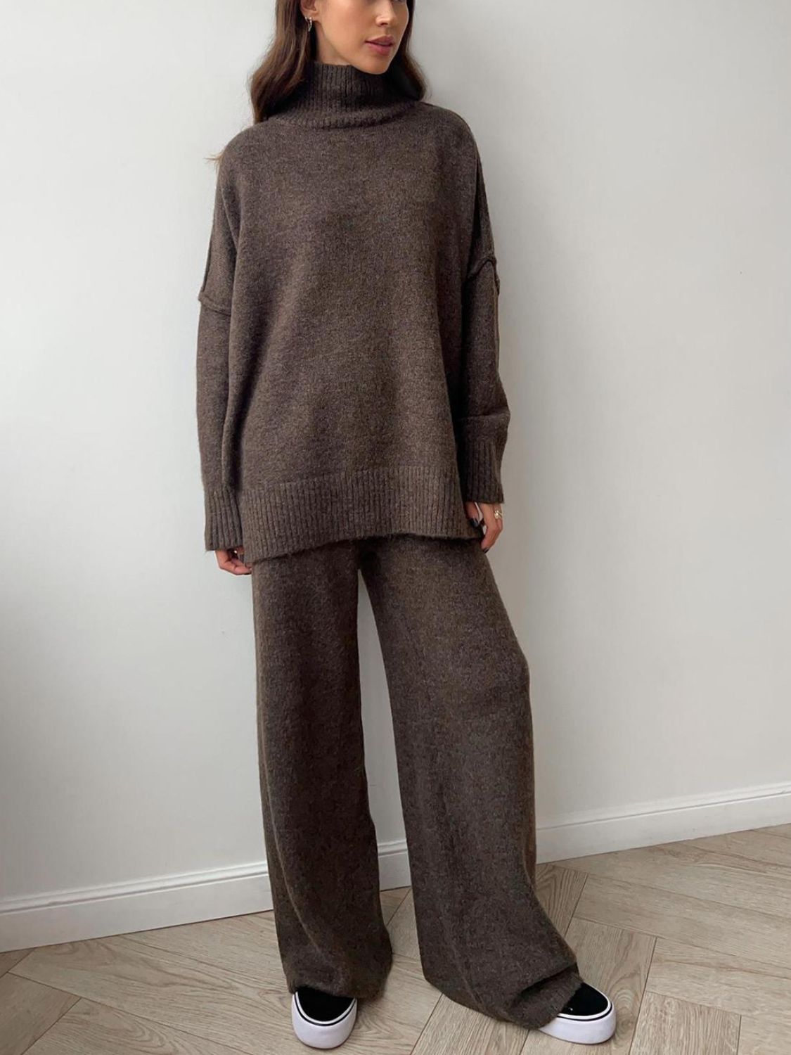 Model wearing cozy brown knit turtleneck and pants sweater set