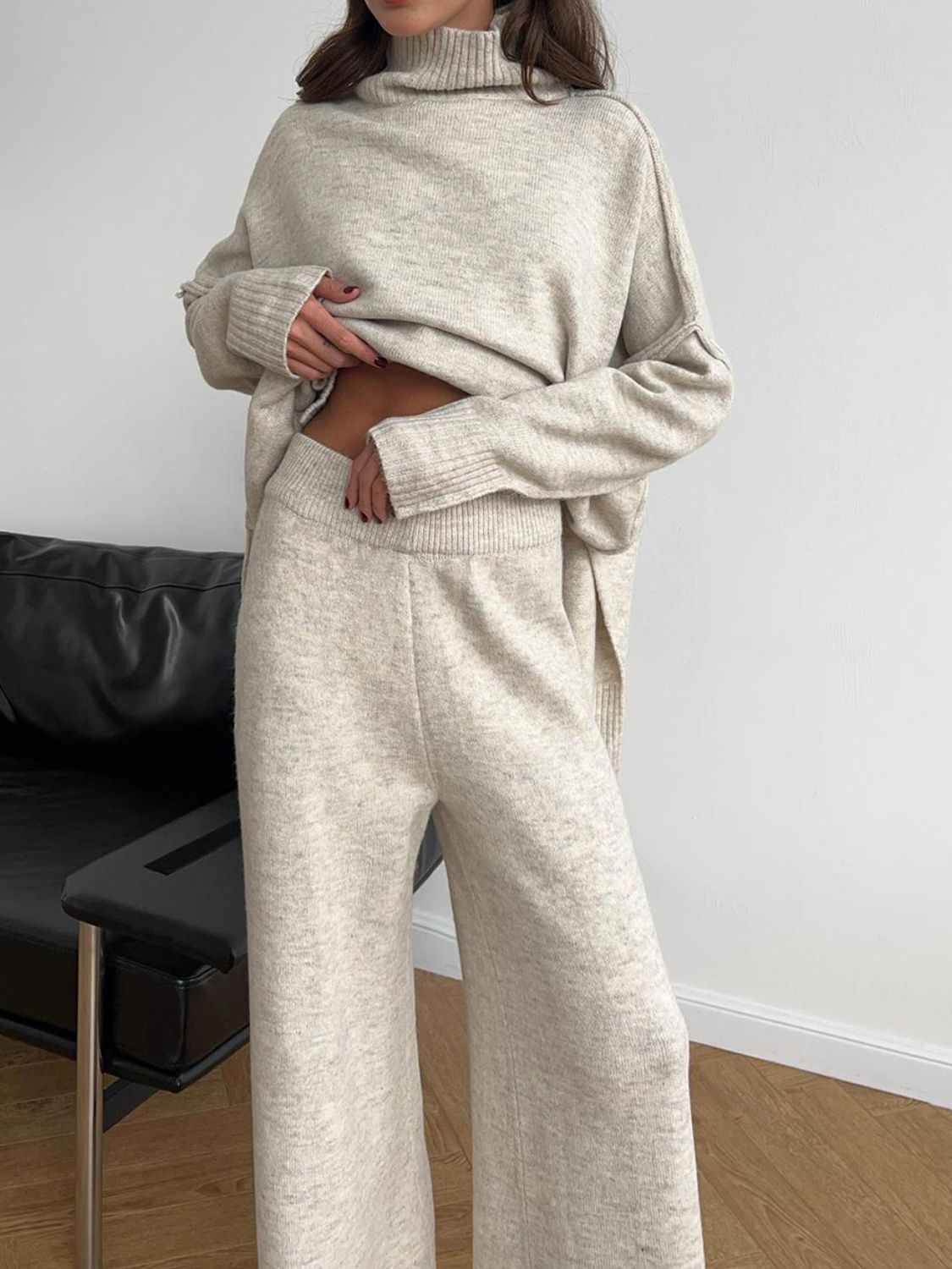 Model wearing cozy beige knit turtleneck and pants sweater set