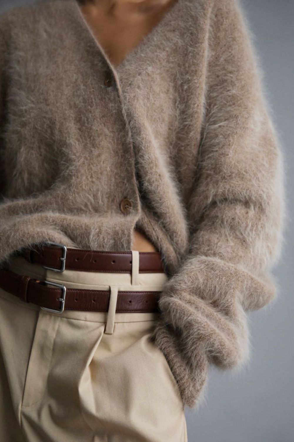 Woman wearing cozy khaki fuzzy button down cardigan