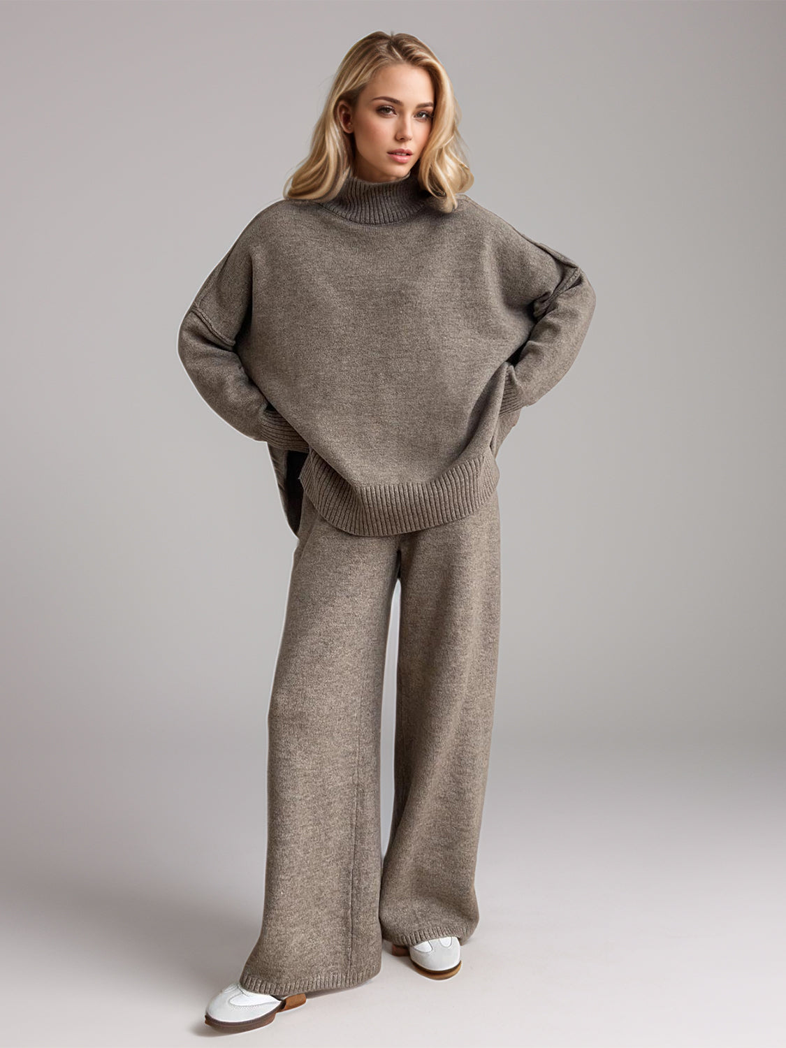 Model wearing cozy taupe knit turtleneck and pants sweater set