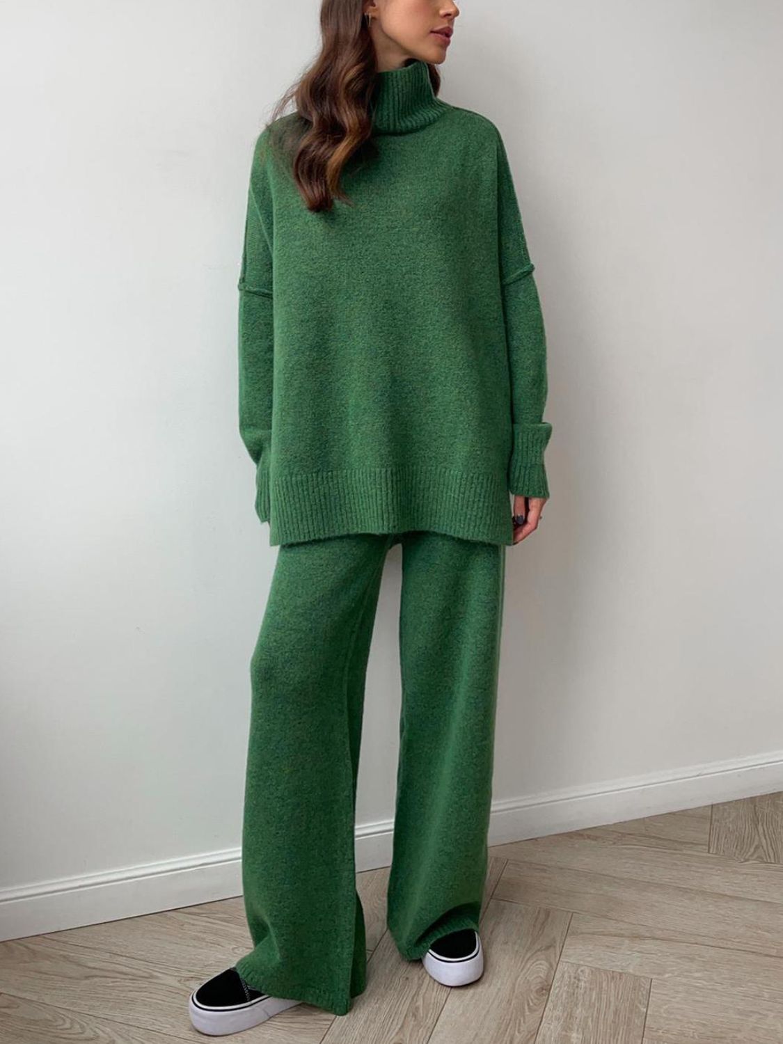 Model wearing cozy green knit turtleneck and pants sweater set